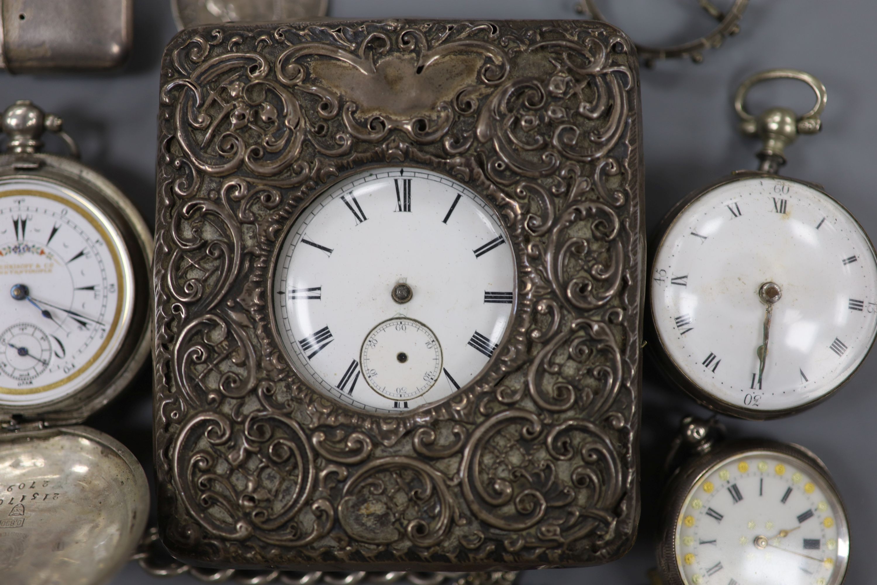Part of a George III silver pair cased verge pocket watch, A Swiss silver cased travelling watch, five other pocket watches including one in silver mounted travelling case and one with silver albert and two mounted coins